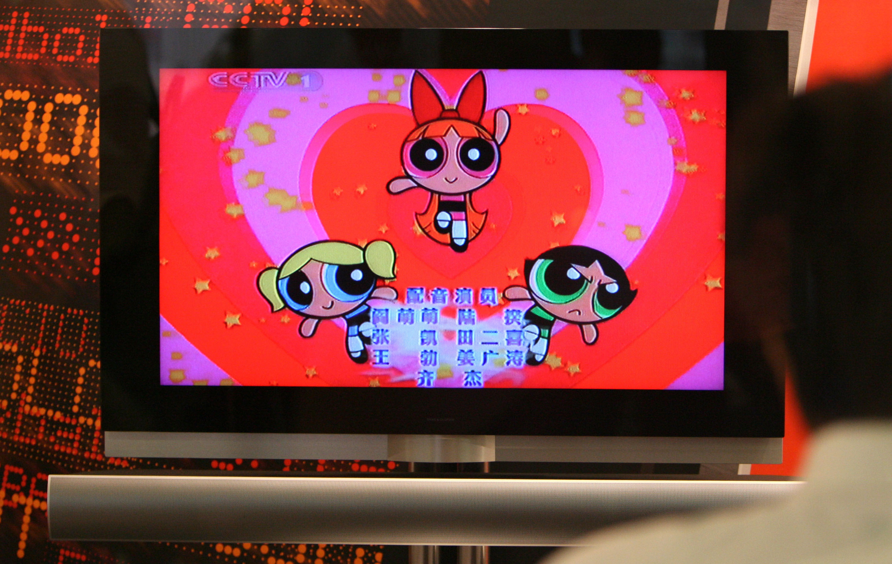 A vendor looks at Cartoon Network's Powerpuff Girls American