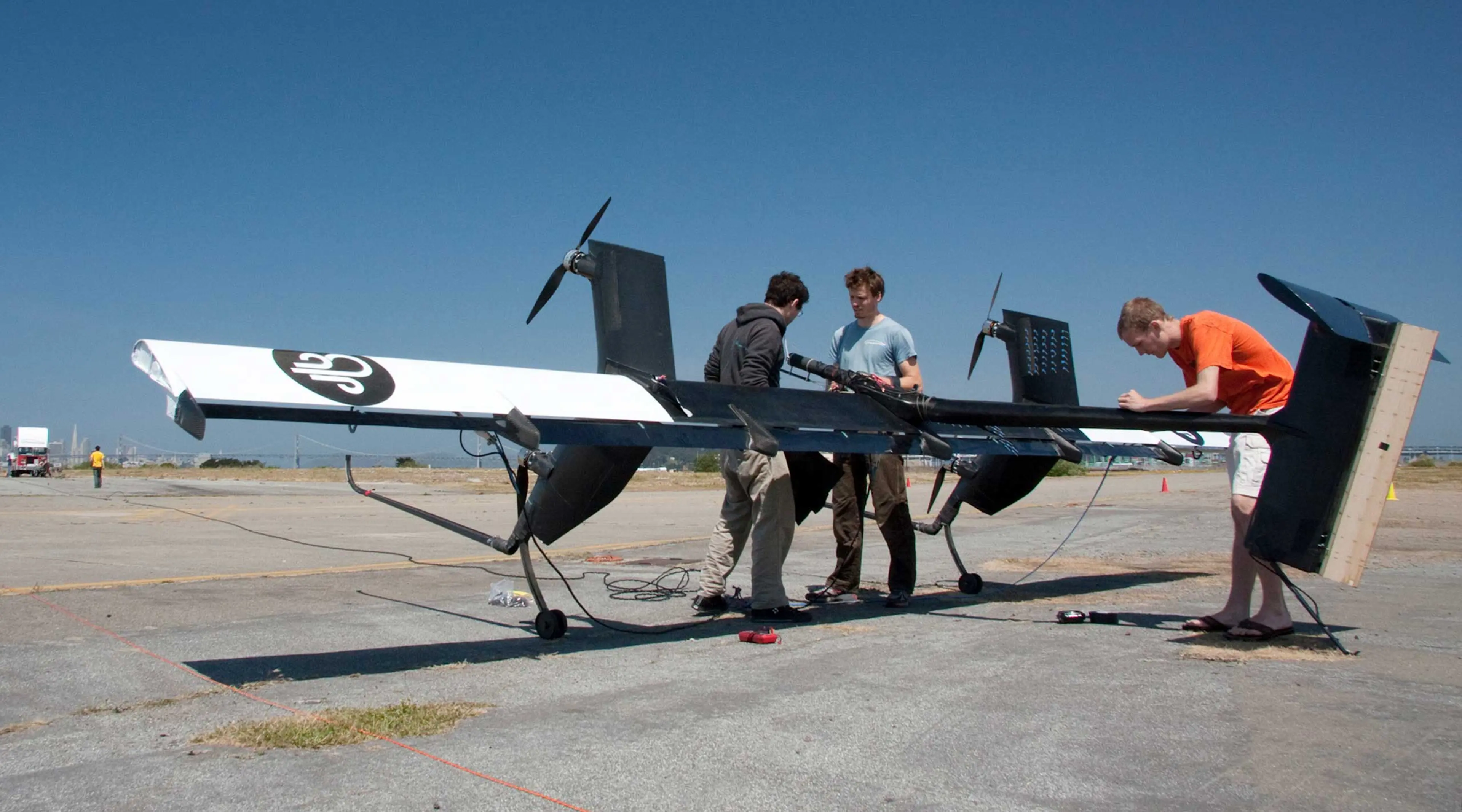 Flight team engineers Kenneth Jensen, left, Damon Vander Lind, center, and Matthew Peddie prepare for the first crosswind test of their 20kW Wing 7 airborne wind turbine prototype in Alameda, Calif. on May 24, 2011