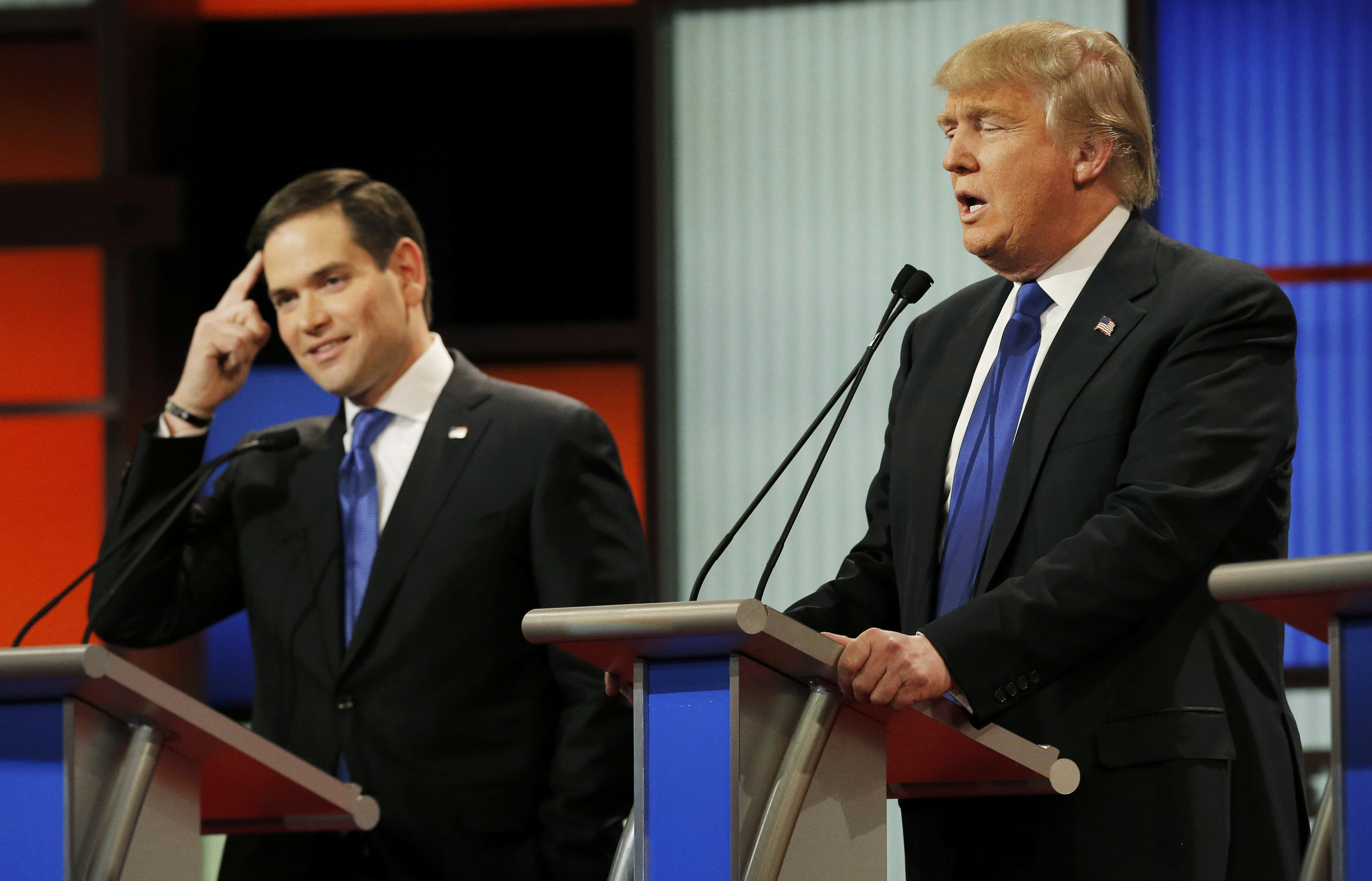 Republican presidential candidate, Florida Sen. Marco Rubio gestures as Donald Trump speaks during a debate on March 3, 2016, in Detroit.