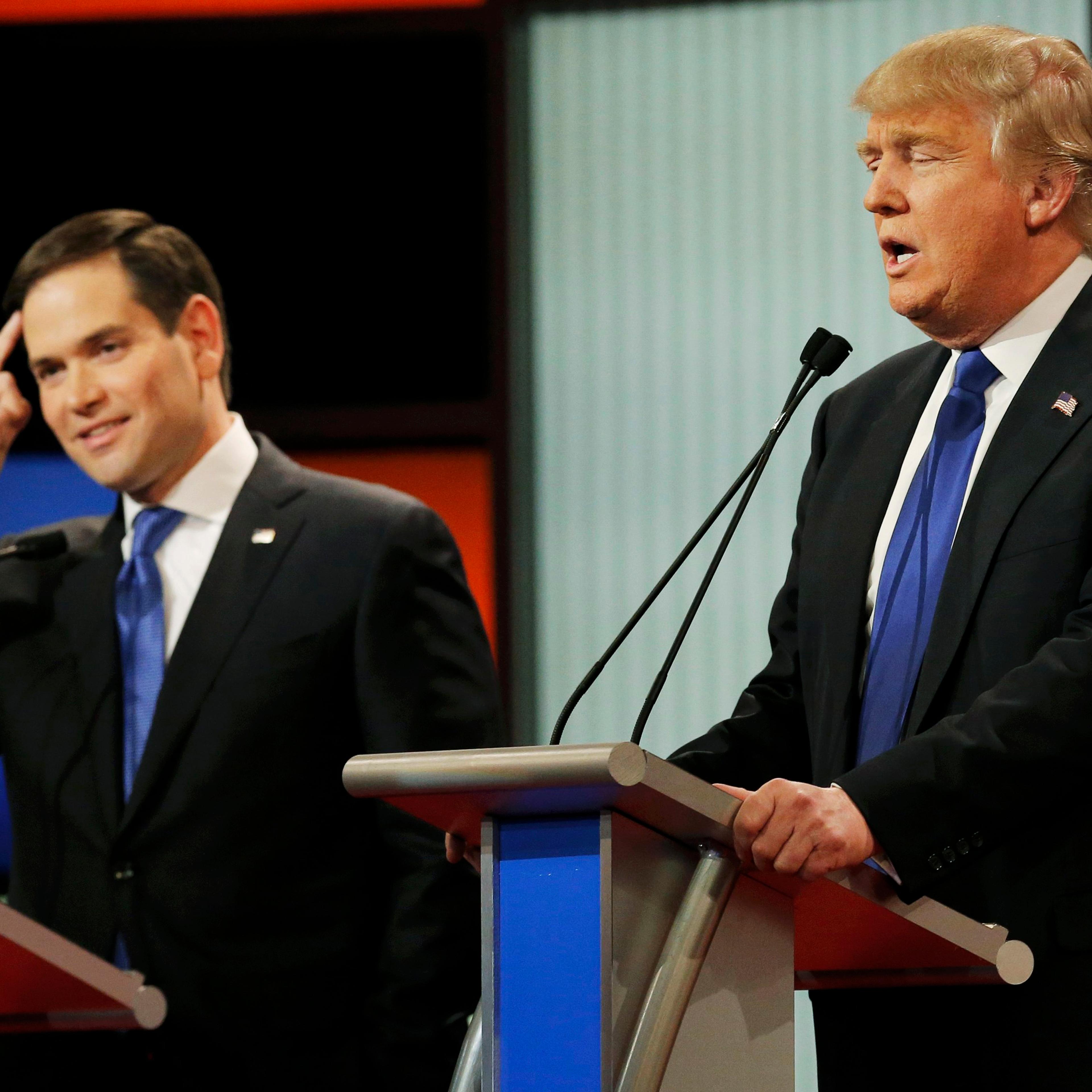 Republican presidential candidate, Florida Sen. Marco Rubio gestures as Donald Trump speaks during a debate on March 3, 2016, in Detroit.