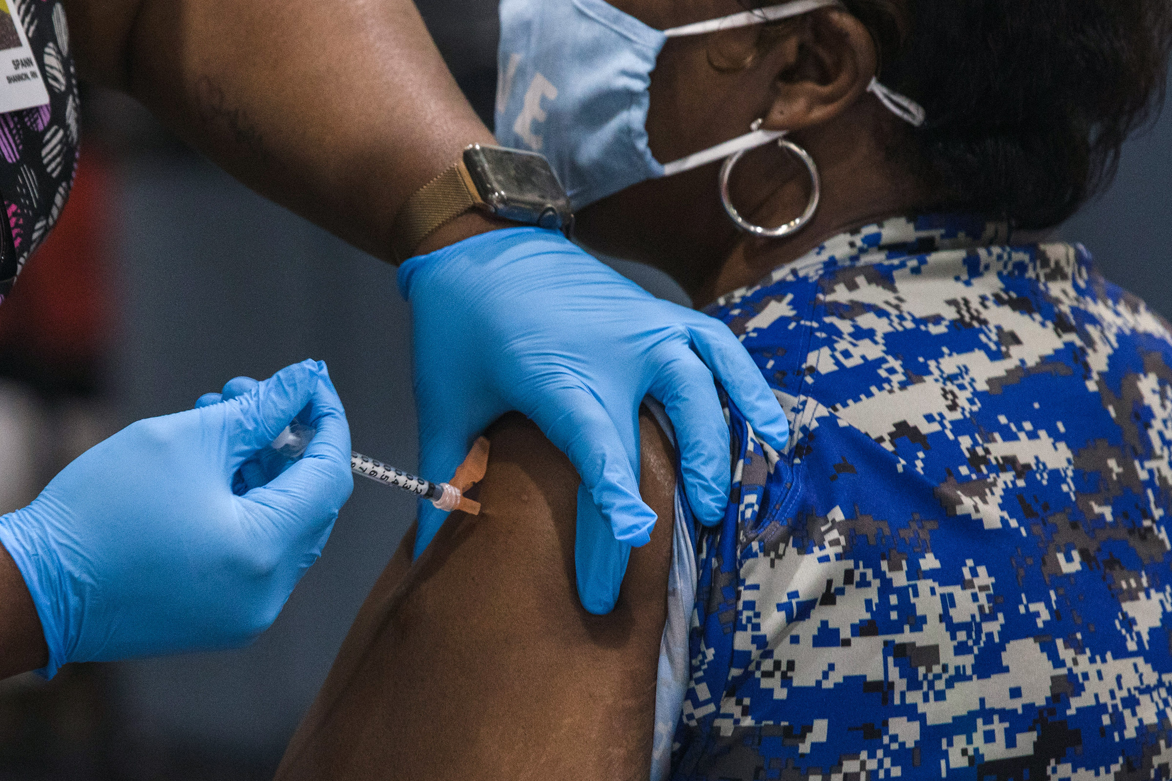 A healthcare worker administers a dose of the Pfizer-BioNTech in South Carolina.