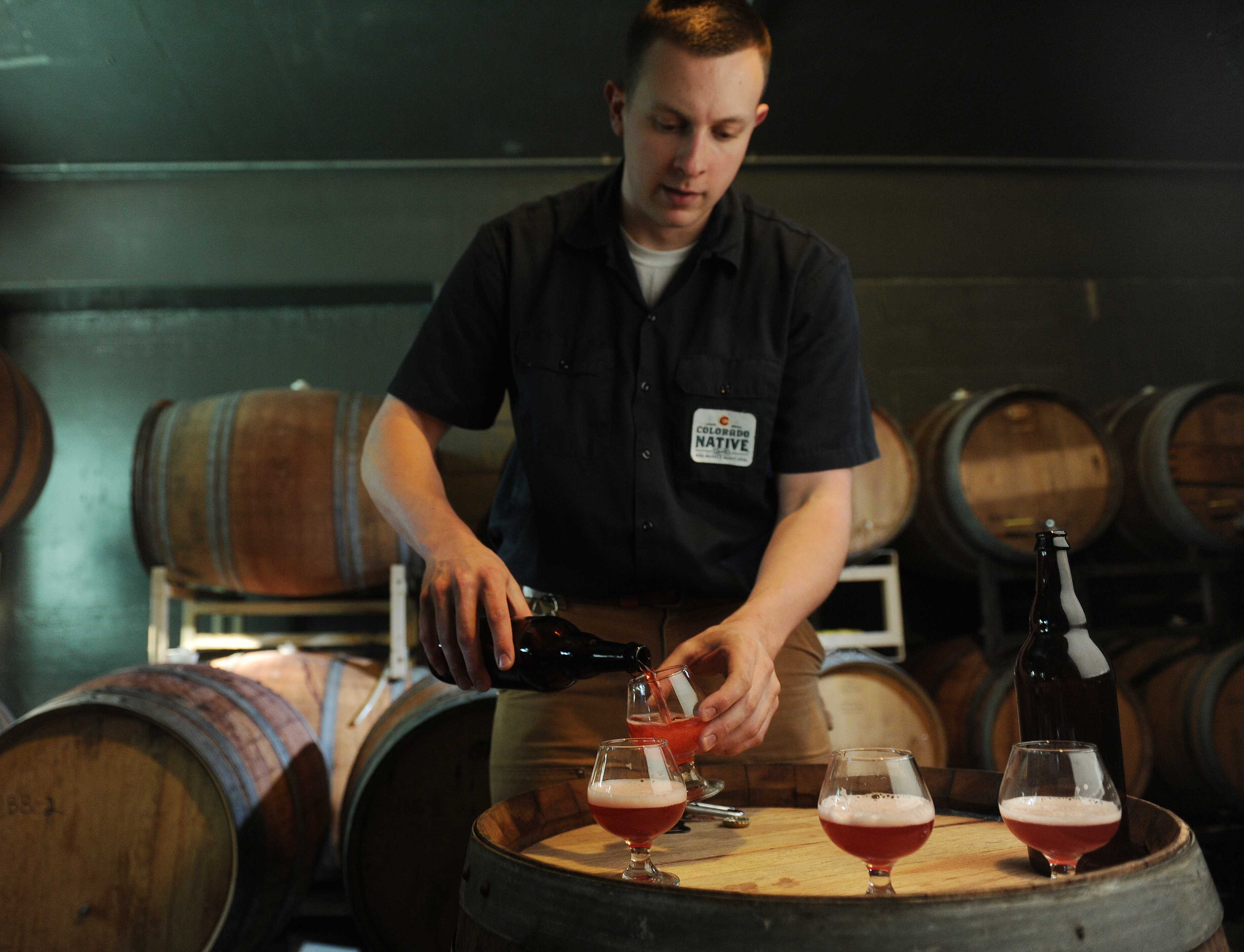 Troy Casey brewer for A.C. Golden pours the cherry sour beer from of the Hidden Barrel Collection at the Coors plant in Golden on Friday, March 2, 2012. Cyrus McCrimmon, The Denver Post