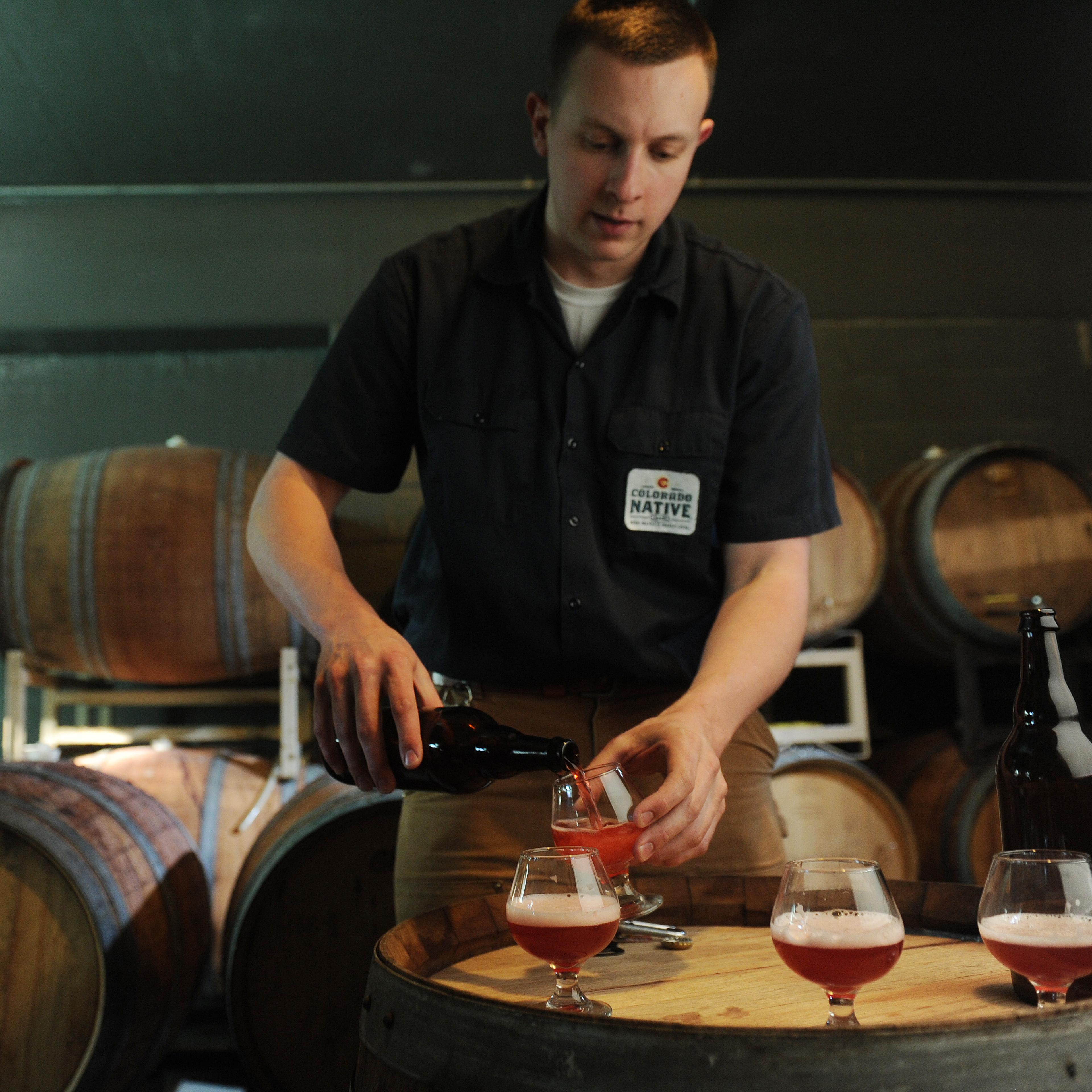 Troy Casey brewer for A.C. Golden pours the cherry sour beer from of the Hidden Barrel Collection at the Coors plant in Golden on Friday, March 2, 2012. Cyrus McCrimmon, The Denver Post
