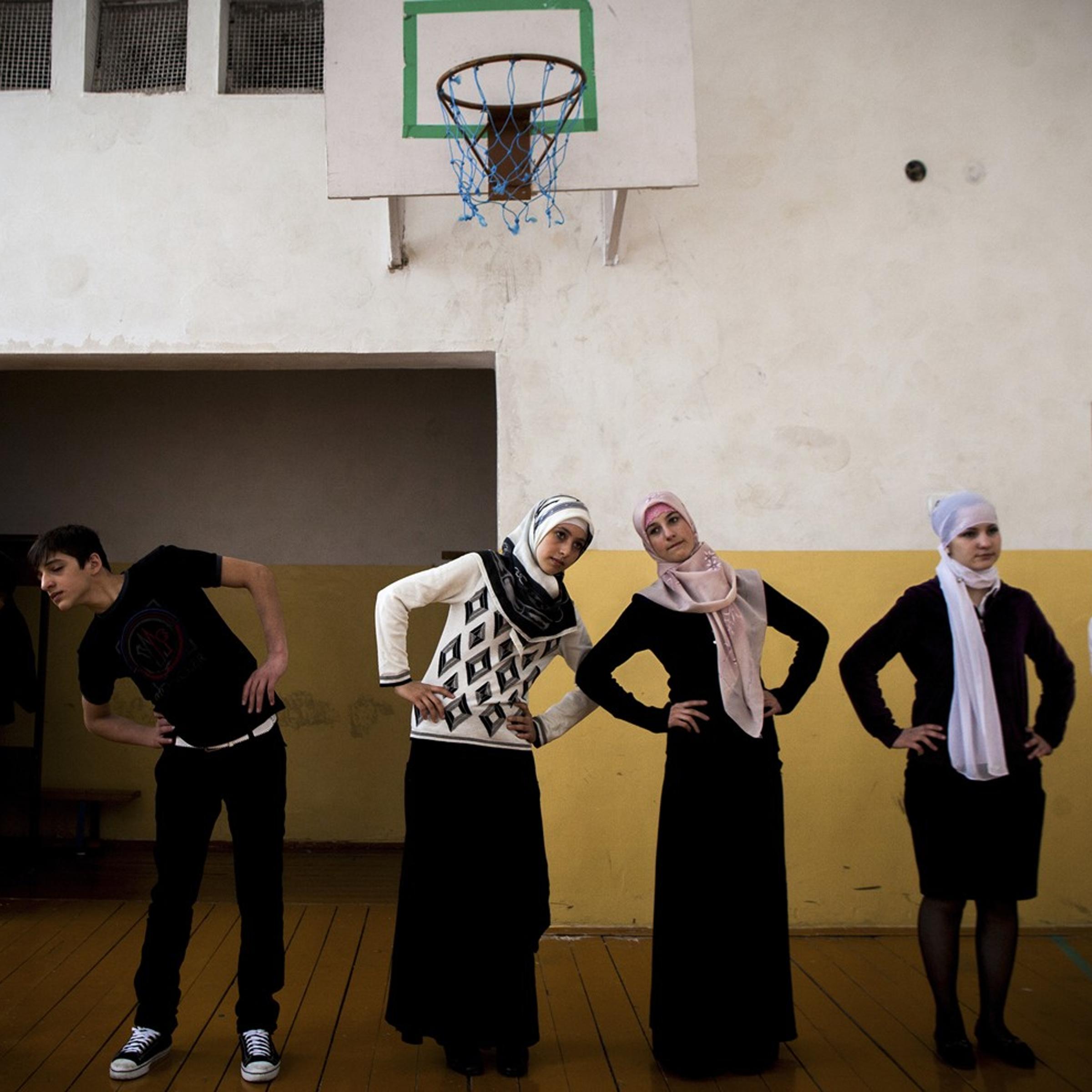 Gym class at School No 1 in the Chechen village of Serzhen-Yurt. The schoolgirls, all dressed in skirts with their heads wrapped in headscarves, say gym clothes violate Muslim dress code.