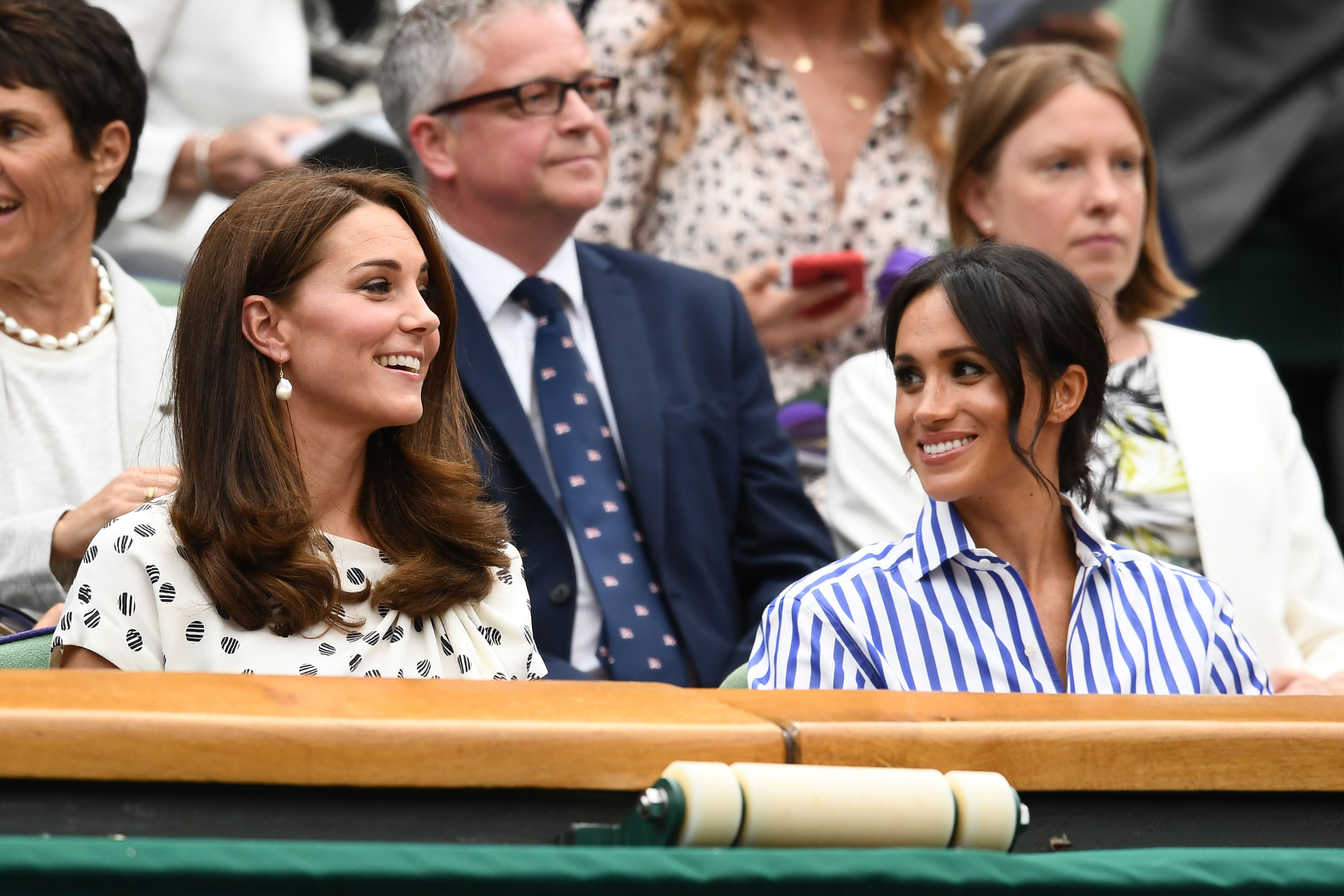 Kate and Meghan smile at each other while watching Wimbledon women's singles final