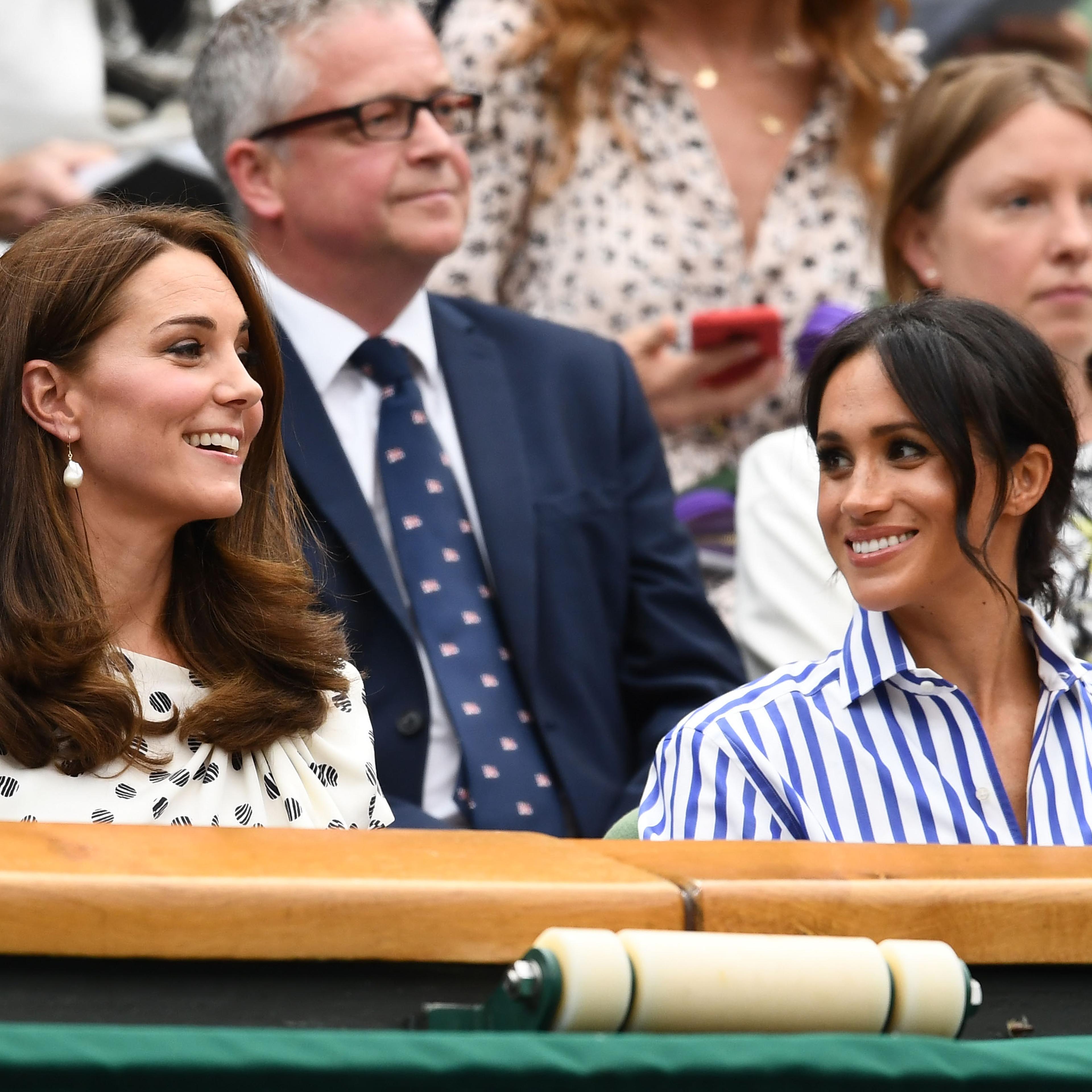 Kate and Meghan smile at each other while watching Wimbledon women's singles final